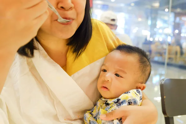 Child boy travel in super market with mother