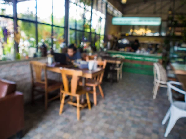 Cafetería interior borrosa con gente ocupada — Foto de Stock