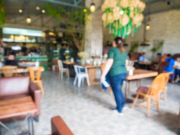 Cafetería interior borrosa con gente ocupada — Foto de Stock