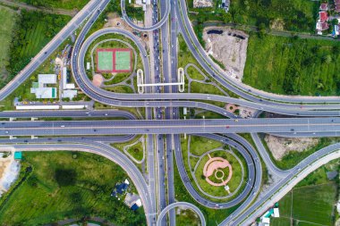 Aerial view transport junction road with satadium green park clipart