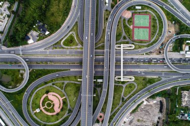 Aerial view transport junction road with satadium green park clipart