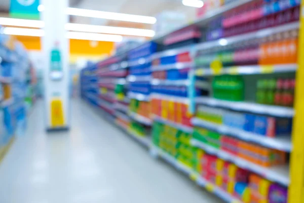Abstraktní rozmazané bokeh police supermarket moderní obchod — Stock fotografie