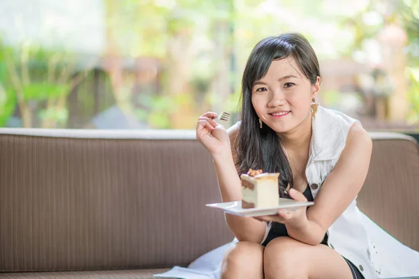 Student asian women sitting in cafe drink coffee — Stock Photo, Image