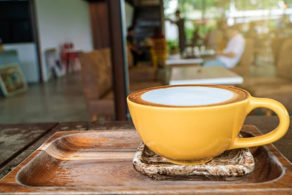 Hot latte art coffee on wood table — Stok Foto