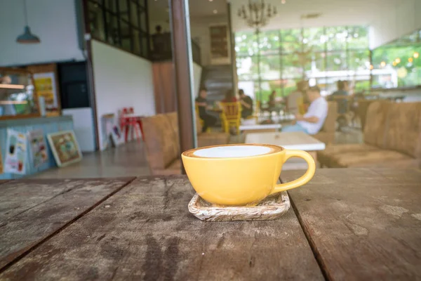 Hot latte art coffee on wood table — Stok Foto