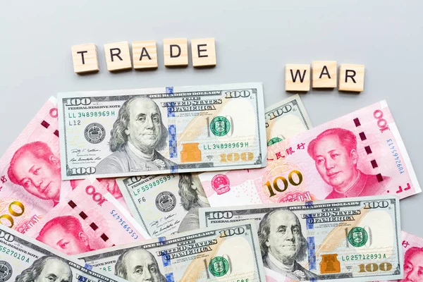 Creative top view flat lay of China and USA cash money. Concept of trade war between USA and China