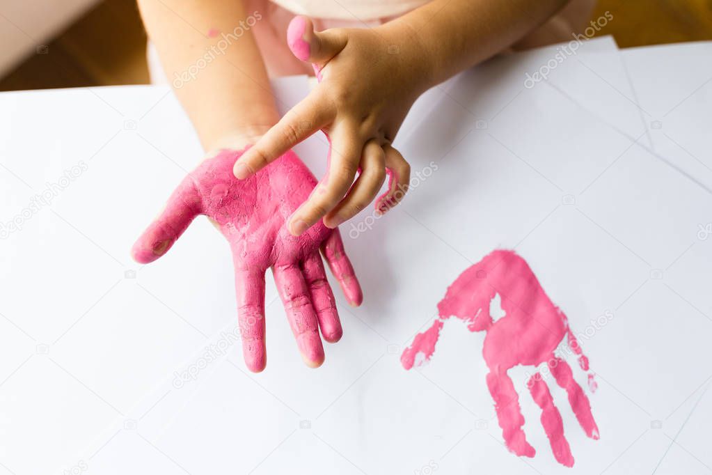 Kid hands and Handprint pink color. Flat lay, top view, overhead, mockup. Preschool Children education concept