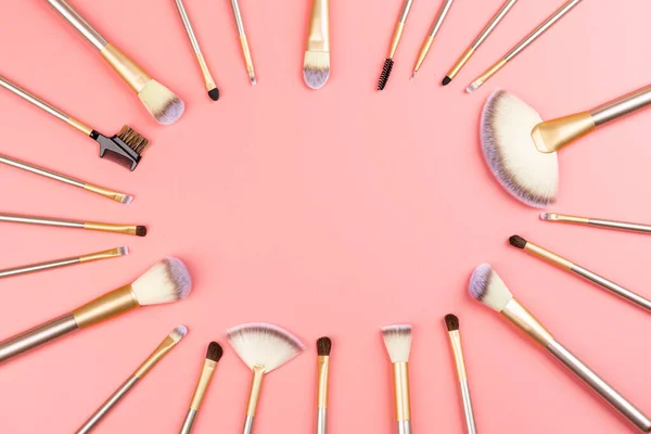 Cosmetic Makeup brushes on pink background. Flat lay, top view, copy space. Makeup accessories, mockup, template — Stock Photo, Image