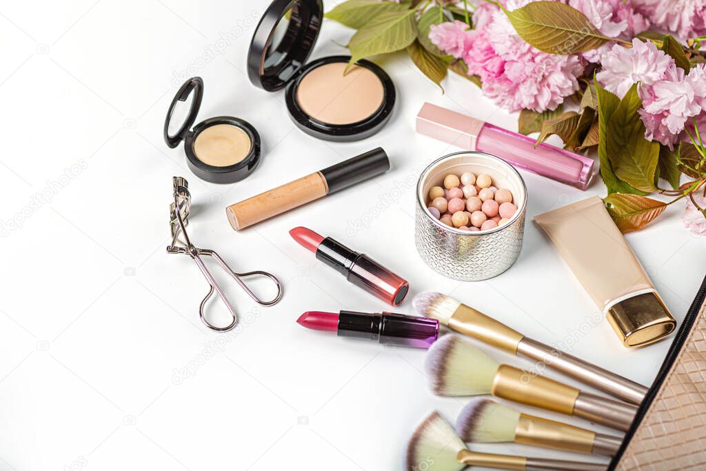 Cosmetic products on white background. Flat lay, top view