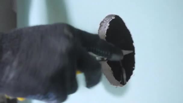 Professional Craftsman Hand Black Glove Cuts Hole Blue Drywall — Stock Video