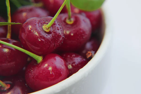 Bright colorful cherry berries on a white background