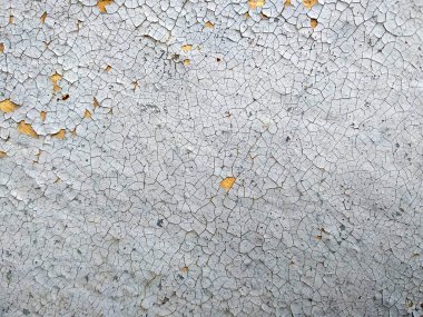 Güneşte yanmış ve boya katmanları soyma ile eski çatlak duvar