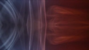 Psikedelik renkli fantezi. Hoş erotik halüsinasyonlar. Koyu bir arkaplana karşı karışık renkli duman uçuşu.