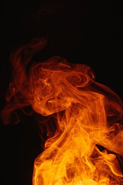 Arka planda turuncu duman. Karmaşık renkli duman girdapları.