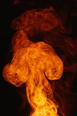 Arka planda turuncu duman. Karmaşık renkli duman girdapları.