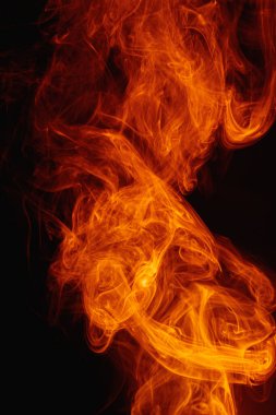 Arka planda turuncu duman. Karmaşık renkli duman girdapları.