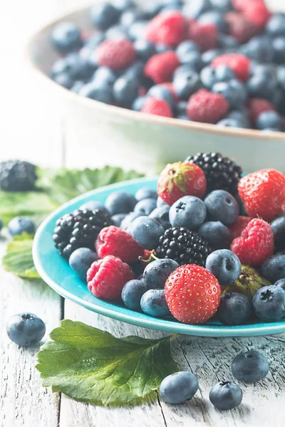 Different berries in bowl. — Stock Photo, Image