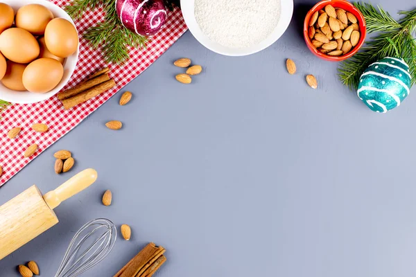 Christmas cookie ingredients, rolling pin and cookie cutters. Christmas cooking concept. Top view