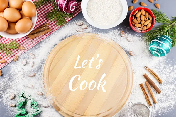 Lets cook text with cutting coard, rolling pin, ingredients in background