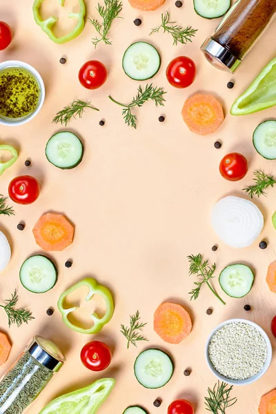 Salad ingredients layout. Food pattern with cherry tomatoes, carrot, cucumbers, radish, greens, pepper and spices