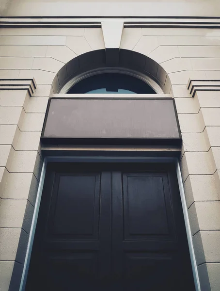 Black historical building Door with entrance singboard