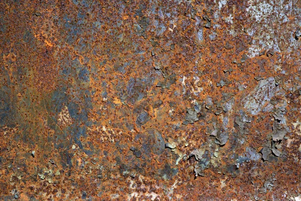 Old metal iron rust background and texture. Rusty metal wall covered with cracked paint