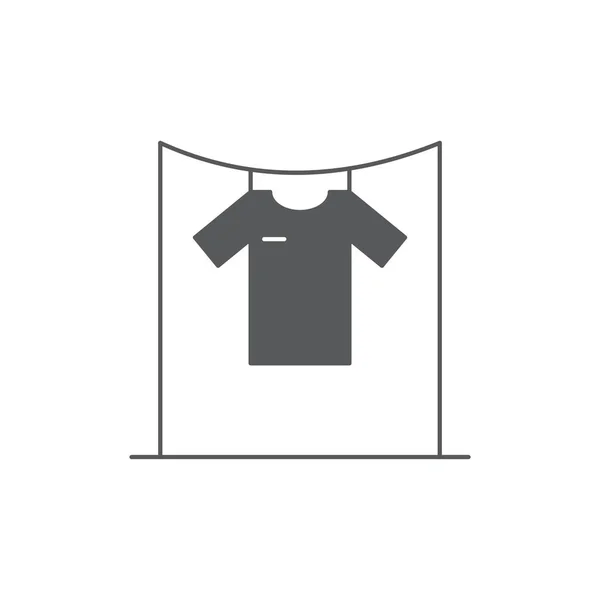 T-shirts penduradas em um ícone de vetor varal símbolo isolado no fundo branco — Vetor de Stock