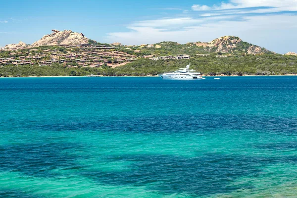 An amazing view of the sea and mountains with a yacht