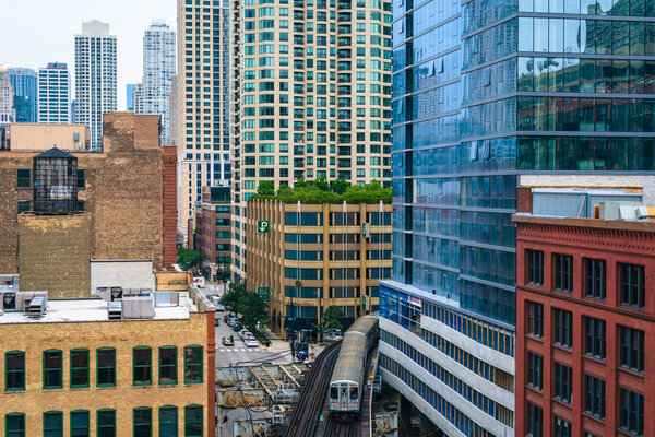 View of an L train and buildings in River North, Chicago, Illinois