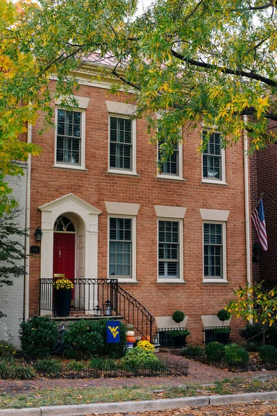 Brick house and fall color in Alexandria, Virginia