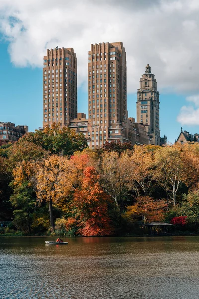 Buildings in the Upper West Side and autumn color along The Lake, in Manhattan, New York City