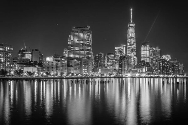 One World Trade Center and Battery Park City at night, seen from Pier 34, Manhattan, New York.