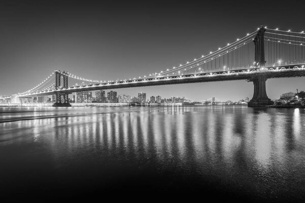 The Manhattan Bridge at night, seen from Brooklyn Bridge Park, in Brooklyn, New York.