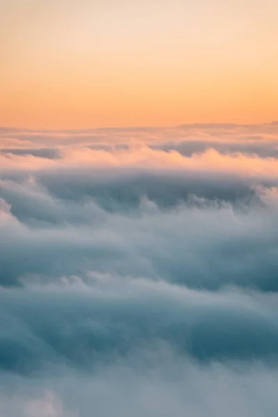 View of marine layer low clouds over Los Angeles at sunset, from