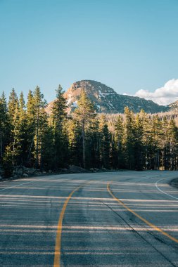 Road and mountain in the Uinta Mountains, in Utah clipart