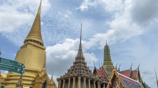 Grand Palace & Emerald Buddha Temple, Bangkok, August 11 2012: Wide view of Wat Pho, also called as Wat Po with beautiful dark clouds in the sky during low light condition