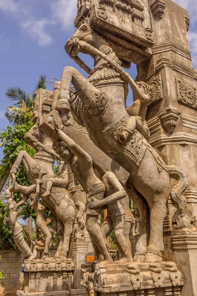 Close up view of sculptures of man playing a drum (thavil in tamil), playing a Shehnai (Nadaswaram in tamil), riding a horse, and an ancient woman greeting,Chennai India, Jan 29 2017 With copy space.