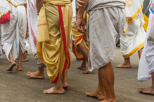 group of Hindu priest seen walking and singing by praising the religious lord or god in chennai india, with selective focus on the subject