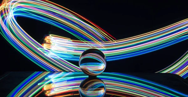 Light painting with crystal ball using led Christmas colorful li — Stock Photo, Image