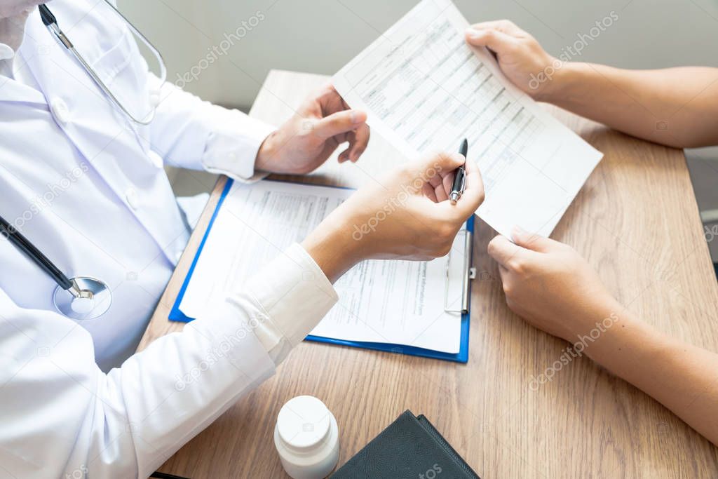 Doctor explaining and giving a consultation to a patient medical