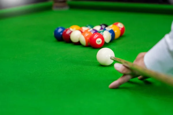 Man's hand and Cue arm playing snooker game or preparing aiming — Stock Photo, Image