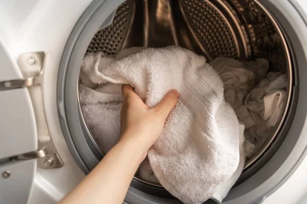 Close Woman Left Hand Loading White Towels Washing Machine — Stock Photo, Image
