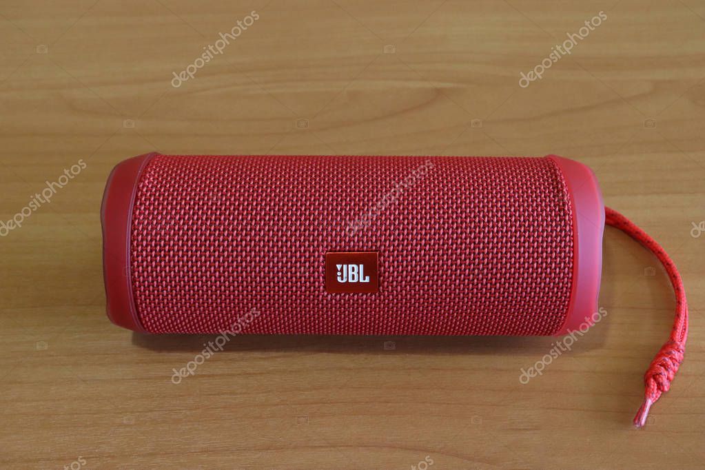 Los Angeles, California, USA - 7 September 2019: Red JBL Flip 4 speaker on a table with free space, Illustrative Editorial