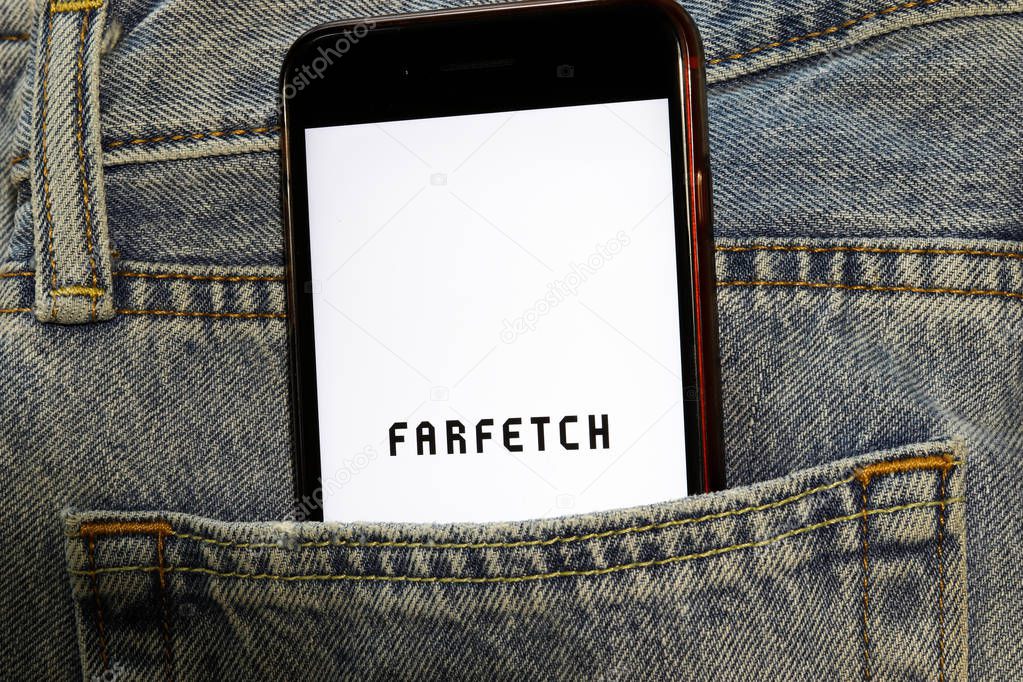 Mobile phone with Fargetch logo on screen in the blue jeans pocket. Los Angeles, California, USA - 13 October 2019, Illustrative Editorial