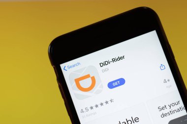 Moscow, Russia - 1 June 2020: DiDi Rider app mobile logo close-up on screen display, Illustrative Editorial clipart