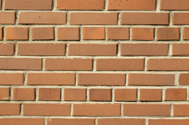 Turuncu duvarlı arka plan. Dokulu tuğlalar. Boşluğu kopyala.
