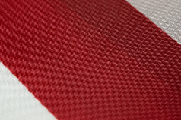 Red and white textile fabric tissue texture background with copy space. Web design template.