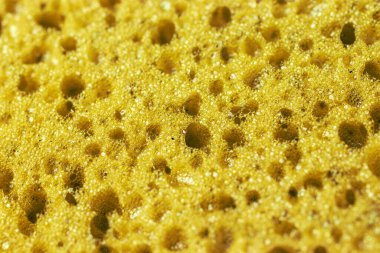 Delikli sarı desenli arka plan. Makro fotoğraf.