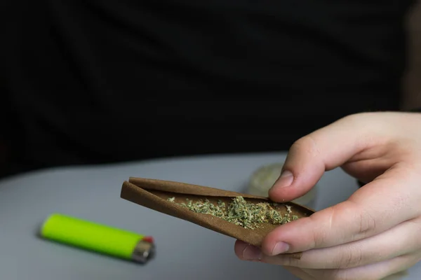 Rolled blunt with cannabis in man hand with copy space — Stock Photo, Image