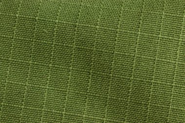 Yeşil şebeke dokusu arka planı. Kumaş materyali makro.